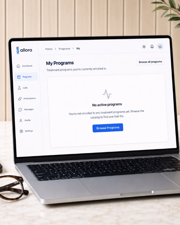 Allora patient portal open to the My Programs page on a laptop, with a smartphone showing the Allora logo, on a warm marble desk